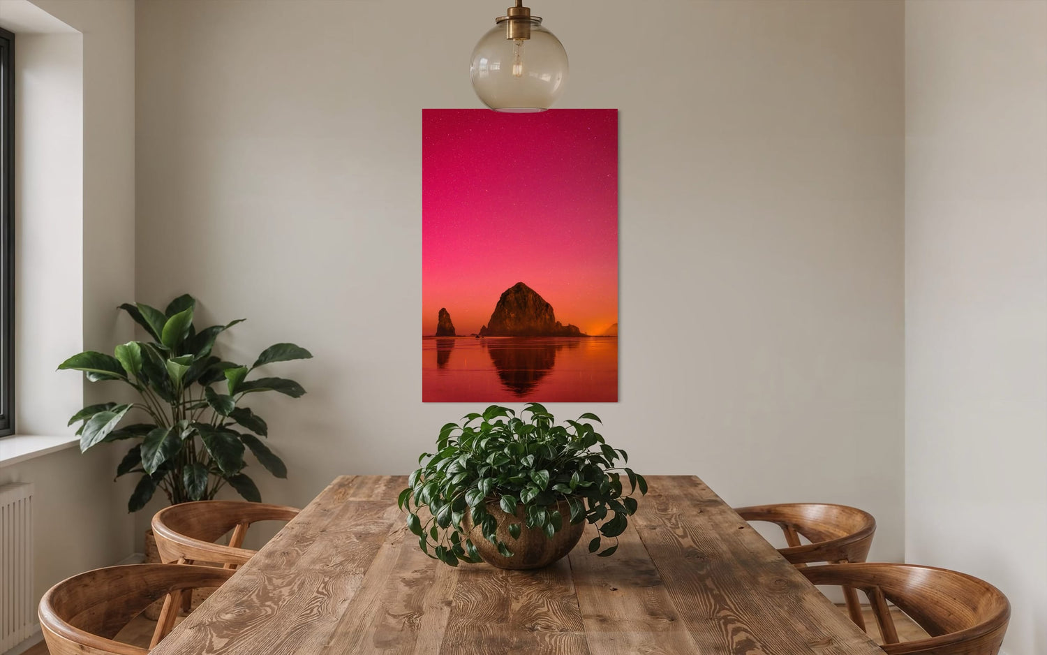 A photo of the Northern Lights in Cannon Beach hangs in a dining room. | Lars Gesing Fine Art | Coastal Wall Art