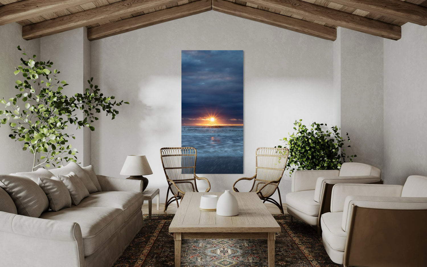 A Cannon Beach sunset picture hangs in a living room.