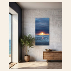 A Cannon Beach sunset picture hangs in a living room.