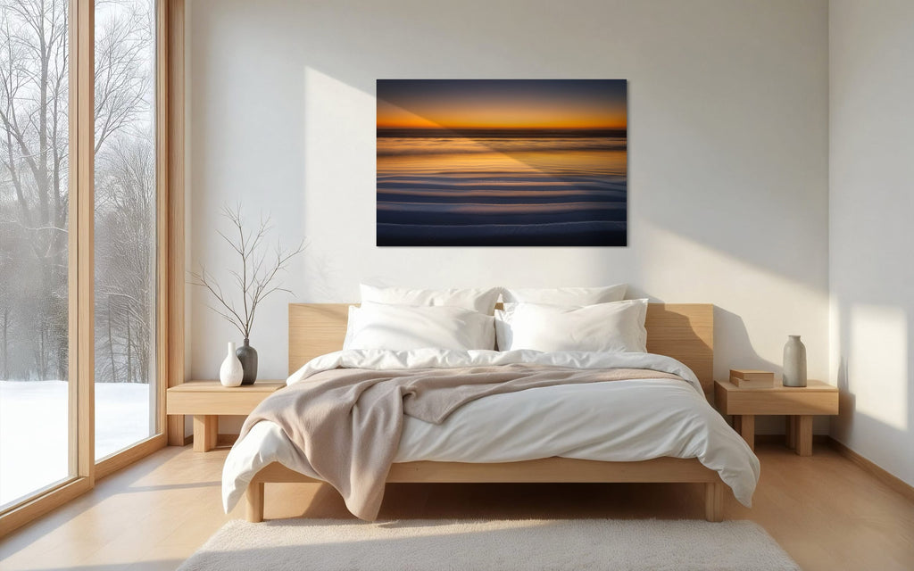 A Cannon Beach sunset photo hangs in a bedroom. | Lars Gesing Fine Art | Coastal Wall Art