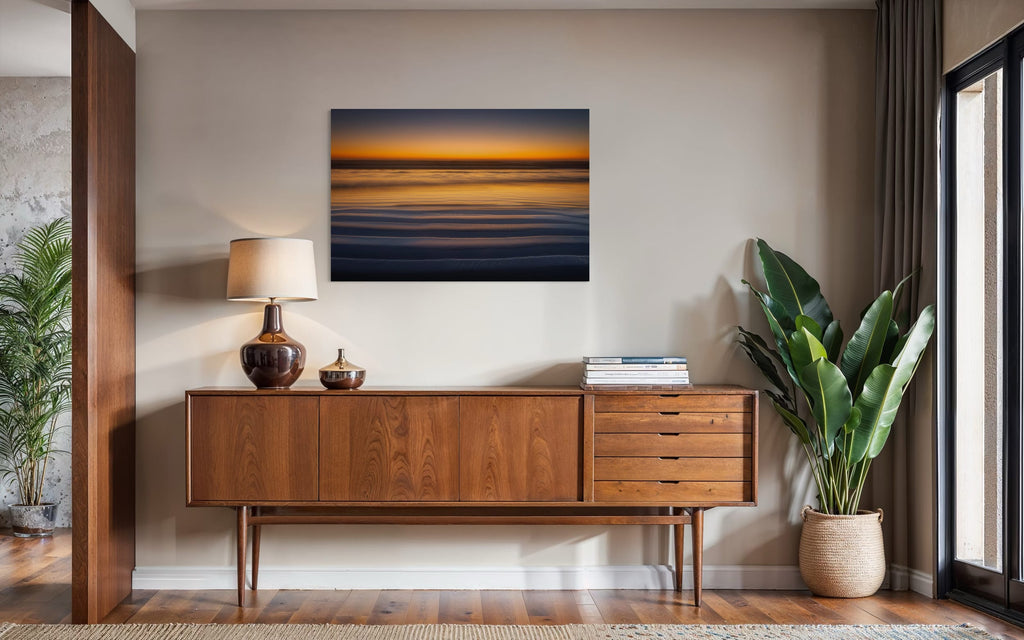 A Cannon Beach sunset photo hangs above a console. | Lars Gesing Fine Art | Coastal Wall Art