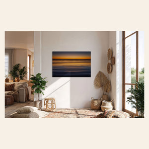 A Cannon Beach sunset photo hangs in a living space. | Lars Gesing Fine Art | Coastal Wall Art