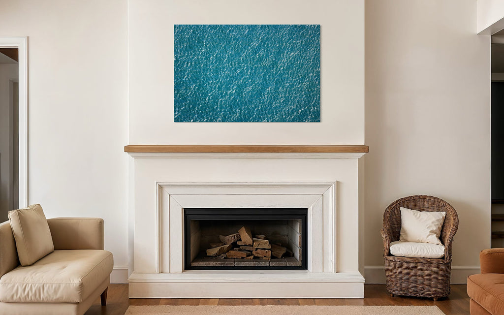 An abstract ocean photo hangs above a fireplace. | Lars Gesing Fine Art | Coastal Wall Art