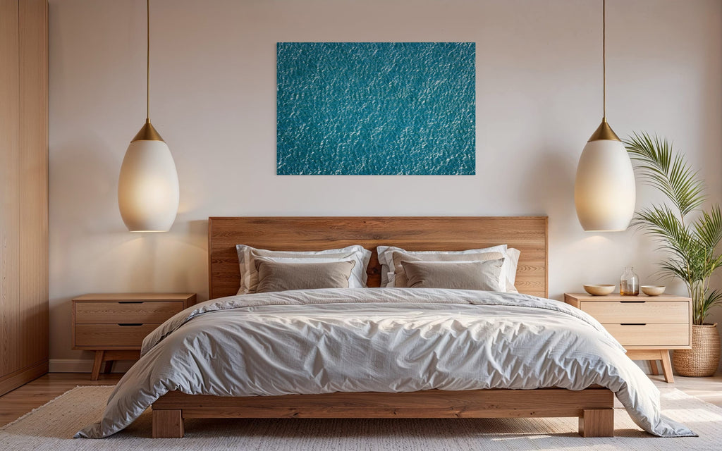 An abstract ocean photo hangs in a bedroom. | Lars Gesing Fine Art | Coastal Wall Art