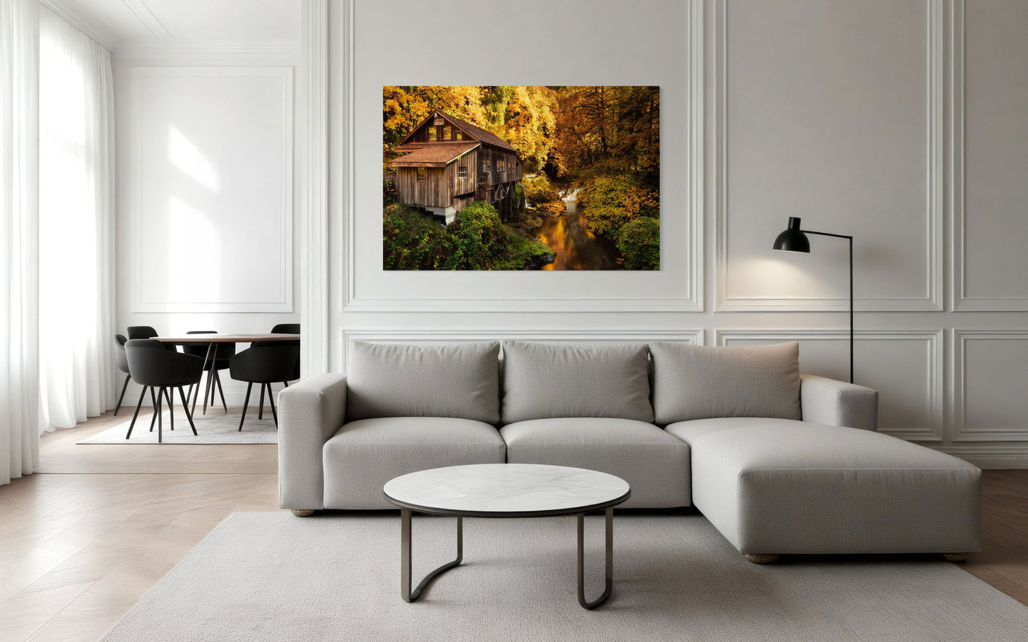 A piece of Washington art showing the Cedar Grist Mill near Woodland hangs in a living room.