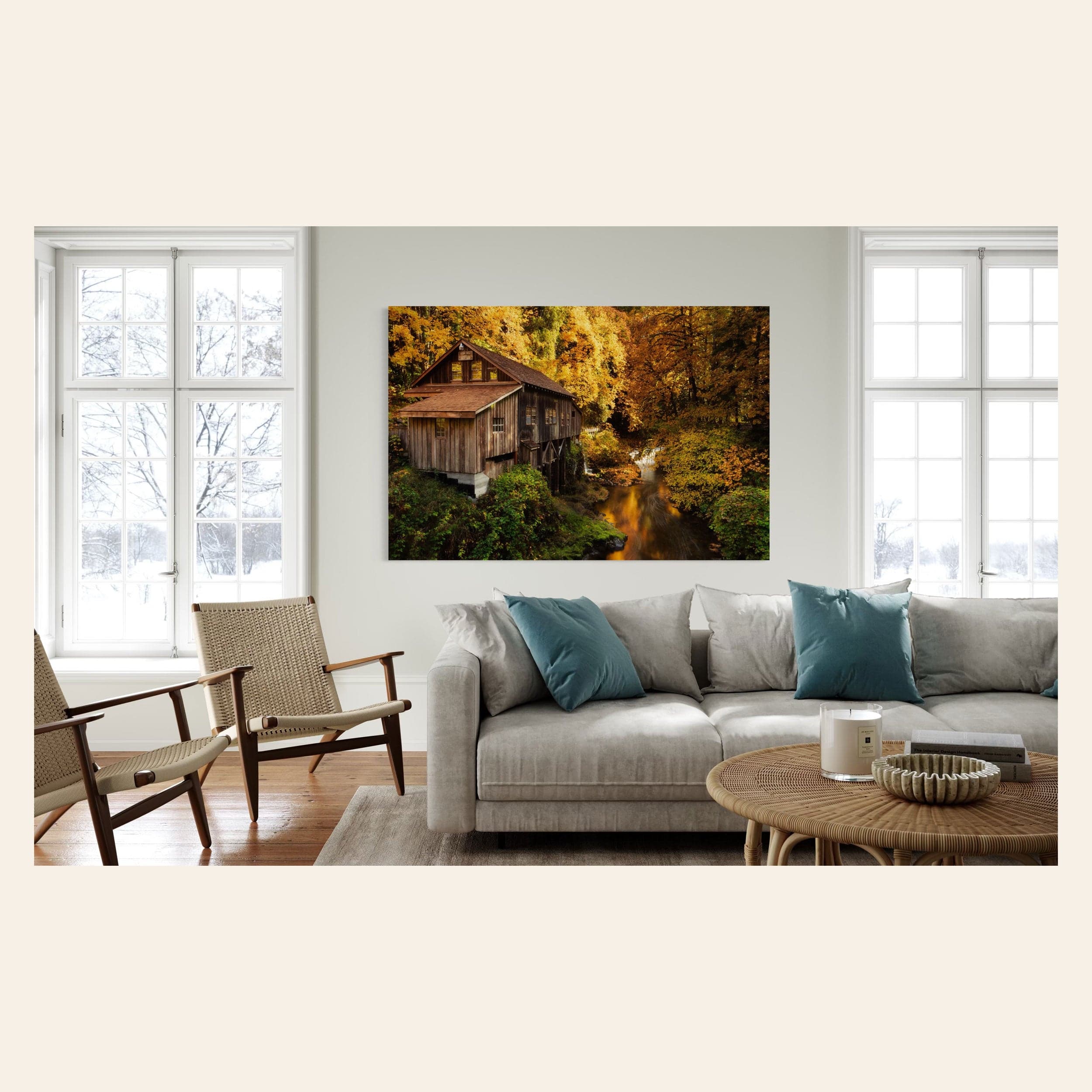 A piece of Washington art showing the Cedar Grist Mill near Woodland hangs in a living room.