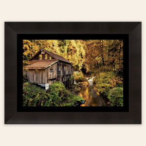 A piece of framed Washington art shows the Cedar Grist Mill near Woodland.