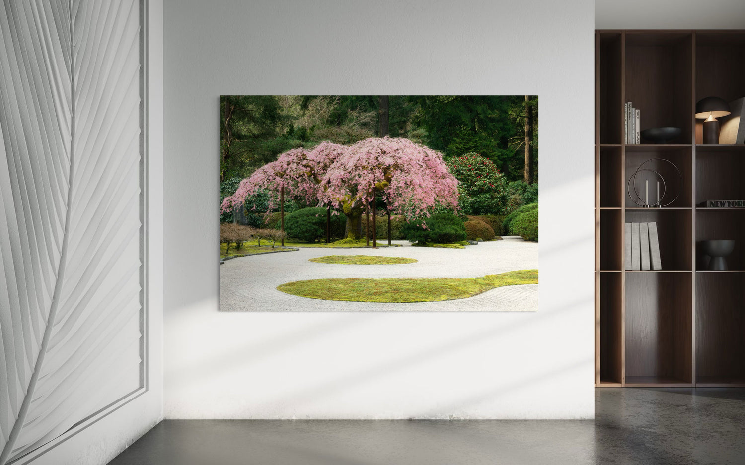 A piece of Portland art showing the cherry blossoms at the Japanese Garden hangs in a living space.