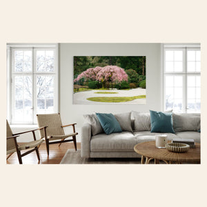 A piece of Portland art showing the cherry blossoms at the Japanese Garden hangs in a living room.