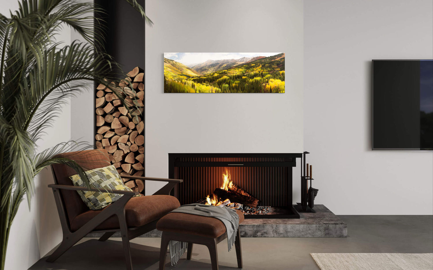 A piece of Colorado art showing the Million Dollar Highway fall colors near Ouray hangs in a living room.