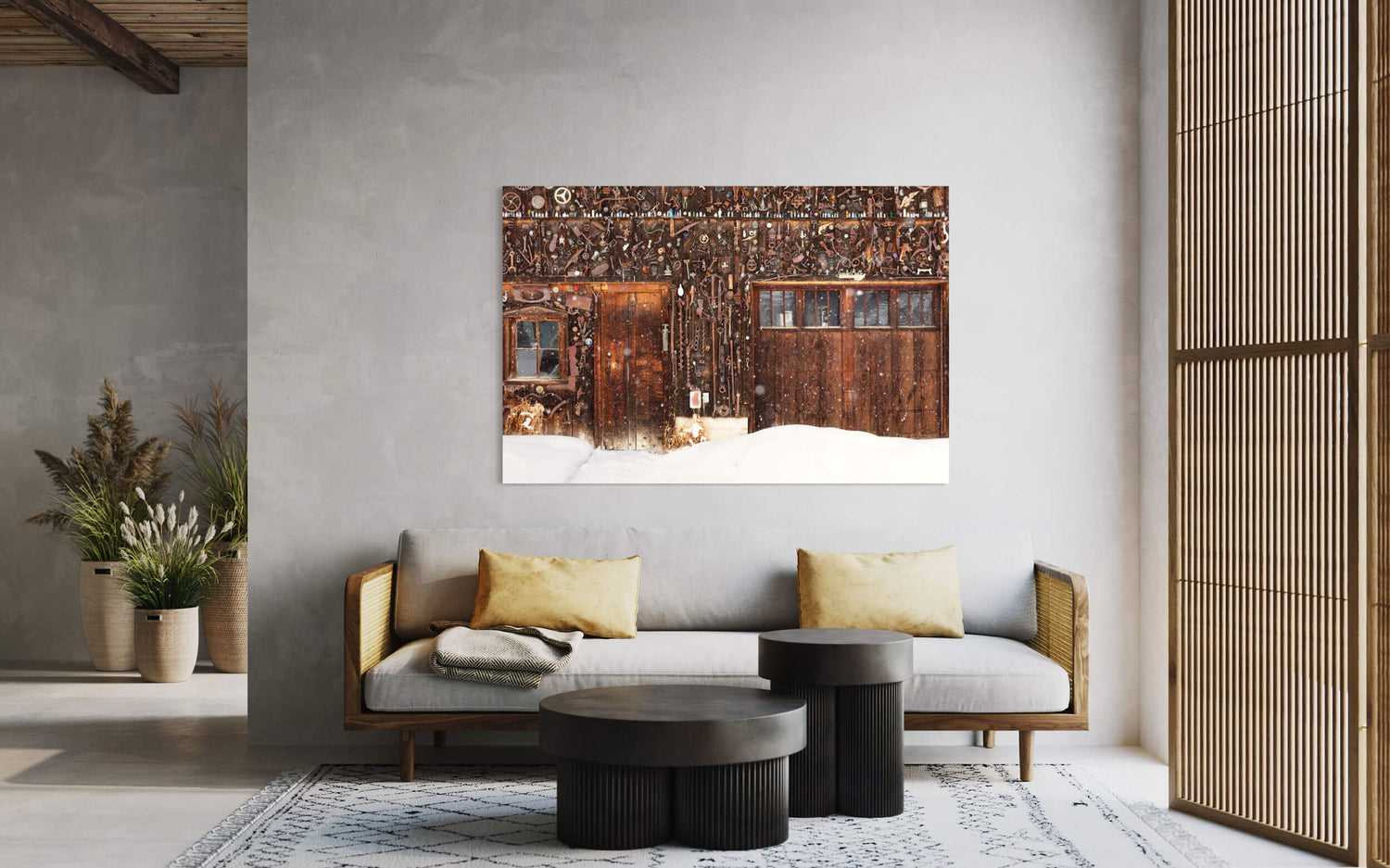 A Crested Butte picture of a snowed-in cabin in winter hangs in a living room.