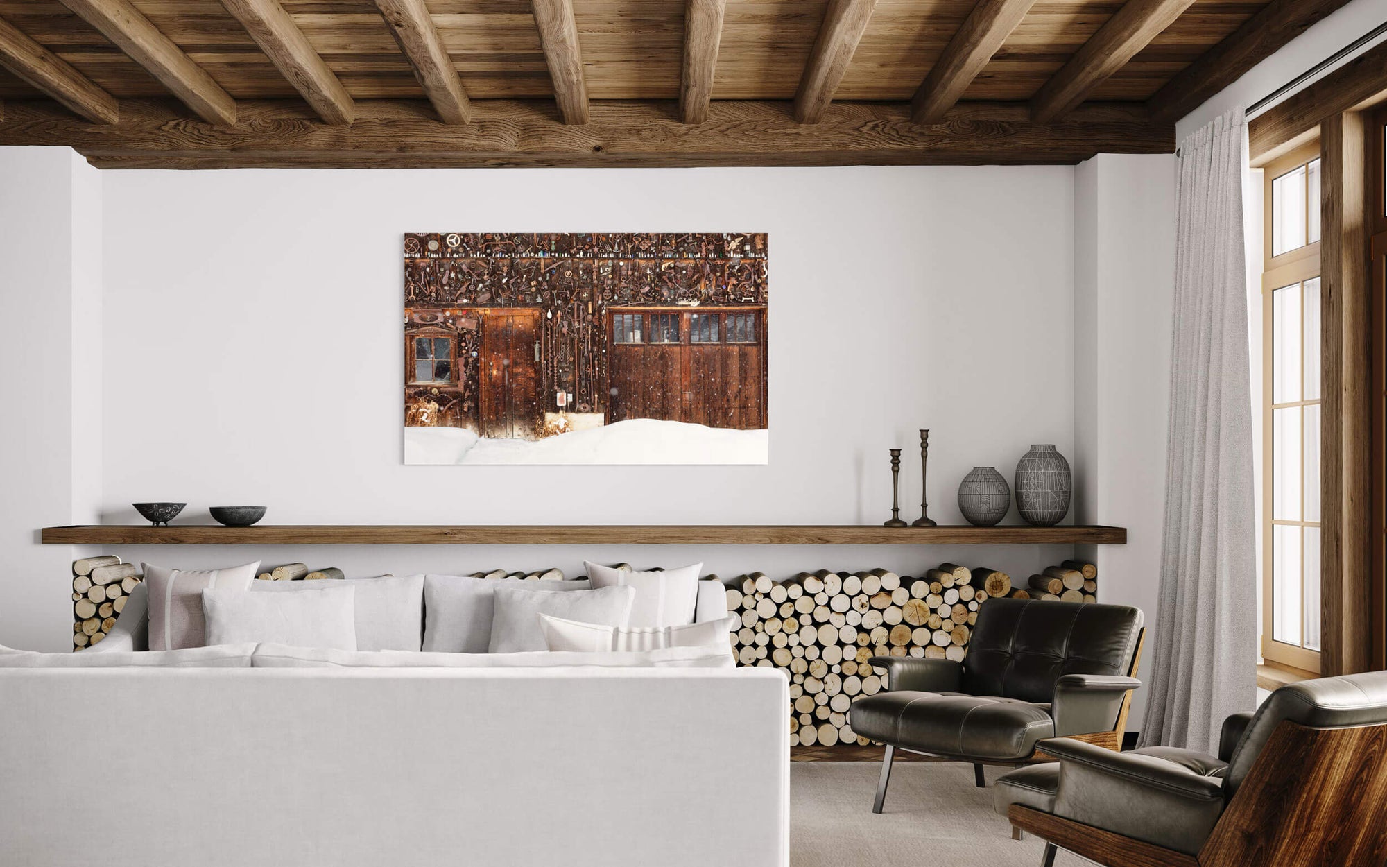 A Crested Butte picture of a snowed-in cabin in winter hangs in a living room.