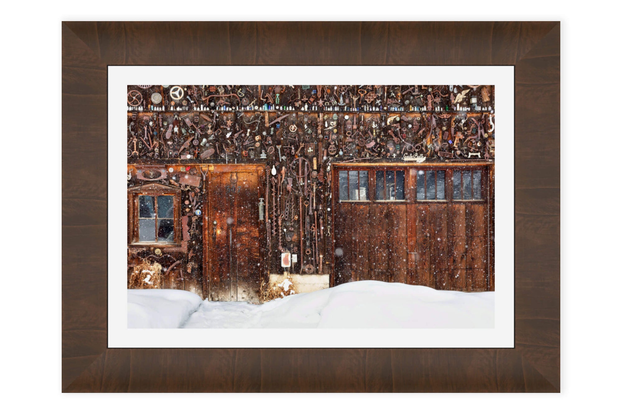 A framed Crested Butte picture of a snowed-in cabin in winter.