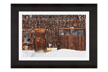 A framed Crested Butte picture of a snowed-in cabin in winter.