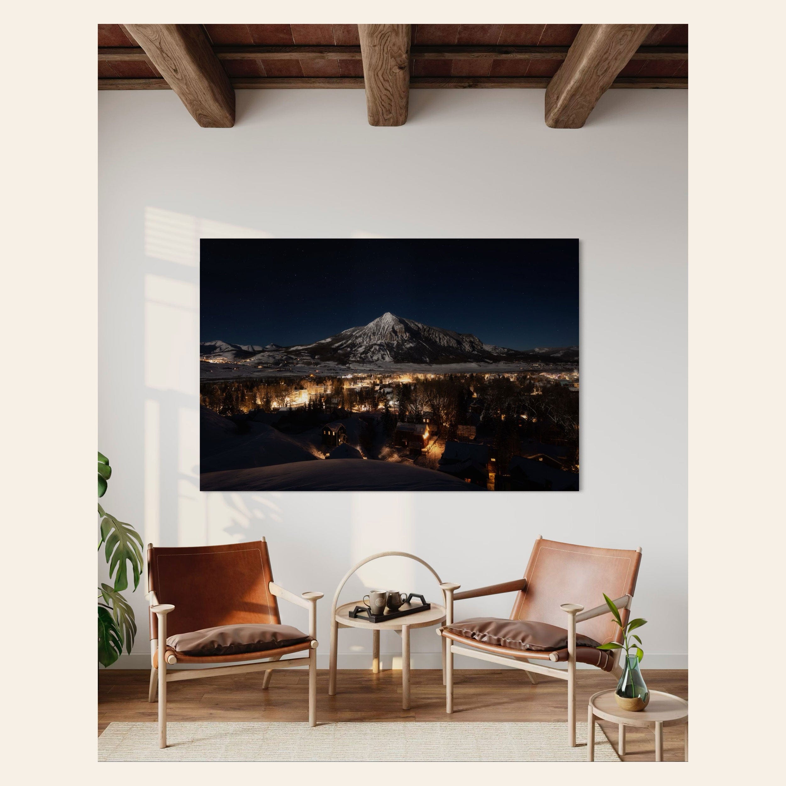 A piece of Crested Butte art showing the Colorado mountain town at night hangs in a living room.