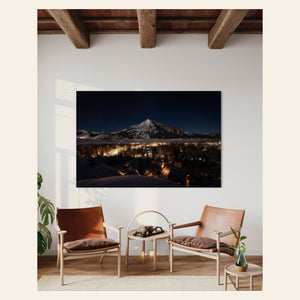 A piece of Crested Butte art showing the Colorado mountain town at night hangs in a living room.