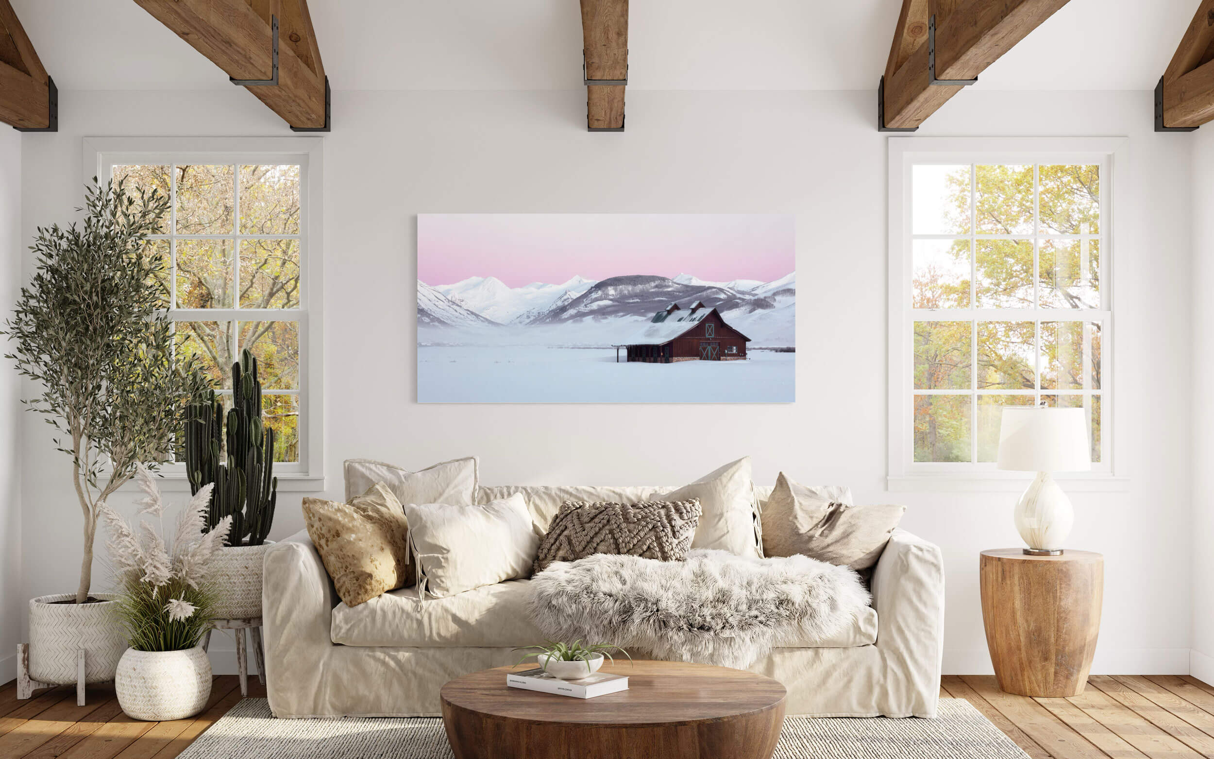 A Crested Butte winter picture created at sunrise hangs in a living room.