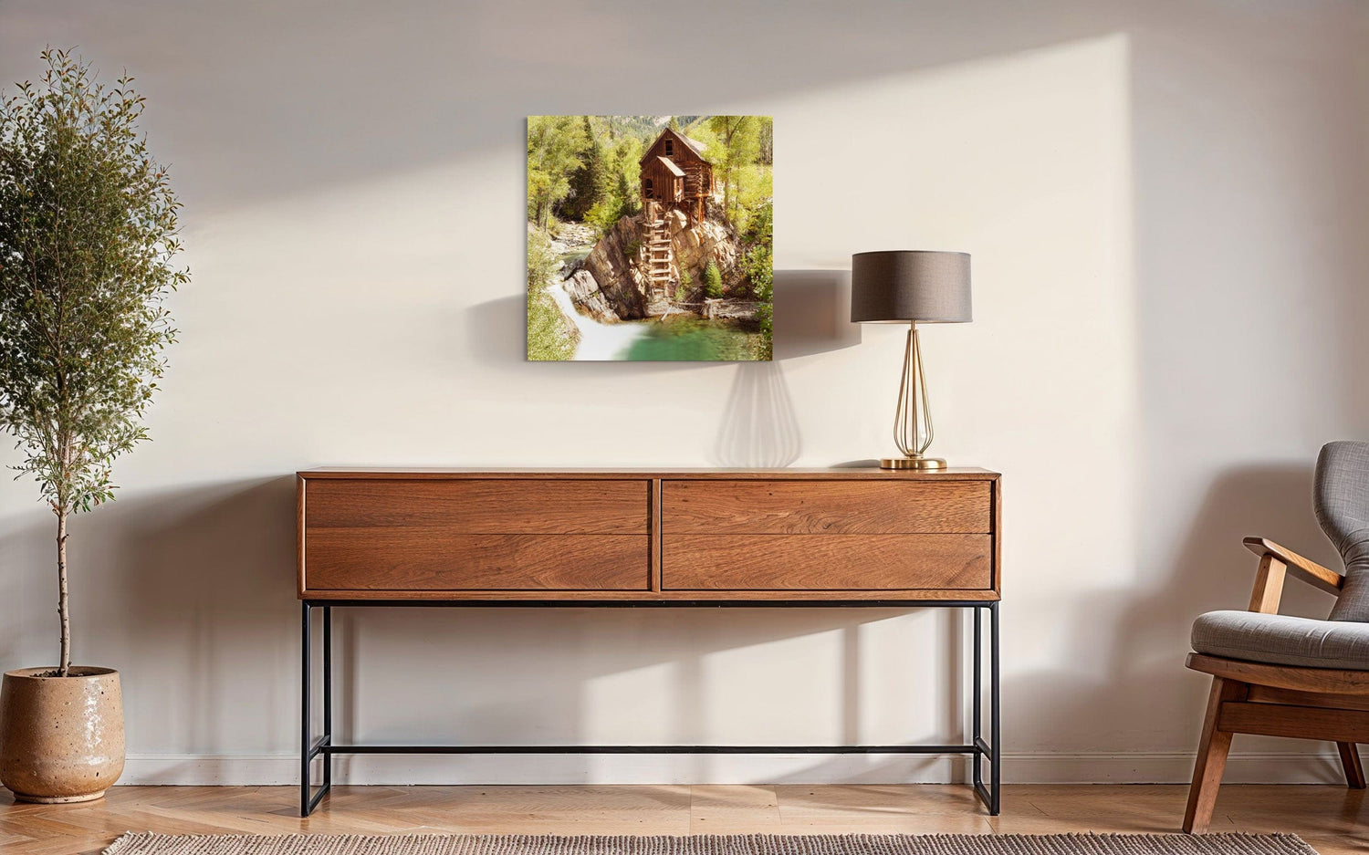 A piece of Colorado art showing a Crystal Mill photo hangs over a console.