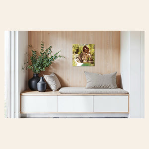 A piece of Colorado art showing a Crystal Mill photo hangs in a sitting area.