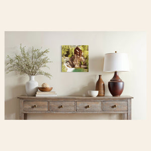 A piece of Colorado art showing a Crystal Mill photo hangs in a dining room.