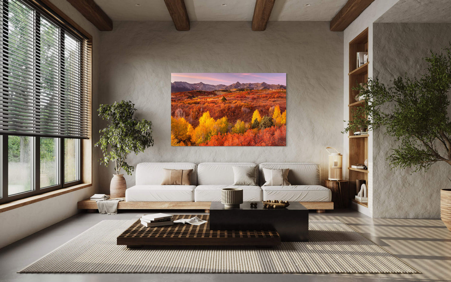 A piece of Telluride art showing a Dallas Divide fall colors picture hangs in a living room.