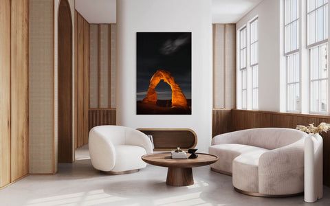 A Delicate Arch picture from Arches National Park in Moab, Utah, hangs in a living room.