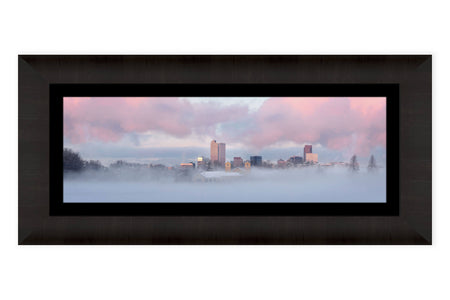 A framed picture of Denver City Park during a sunrise in winter.