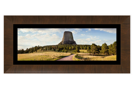 A framed Devil's Tower National Monument picture shows one of the trails in Wyoming.