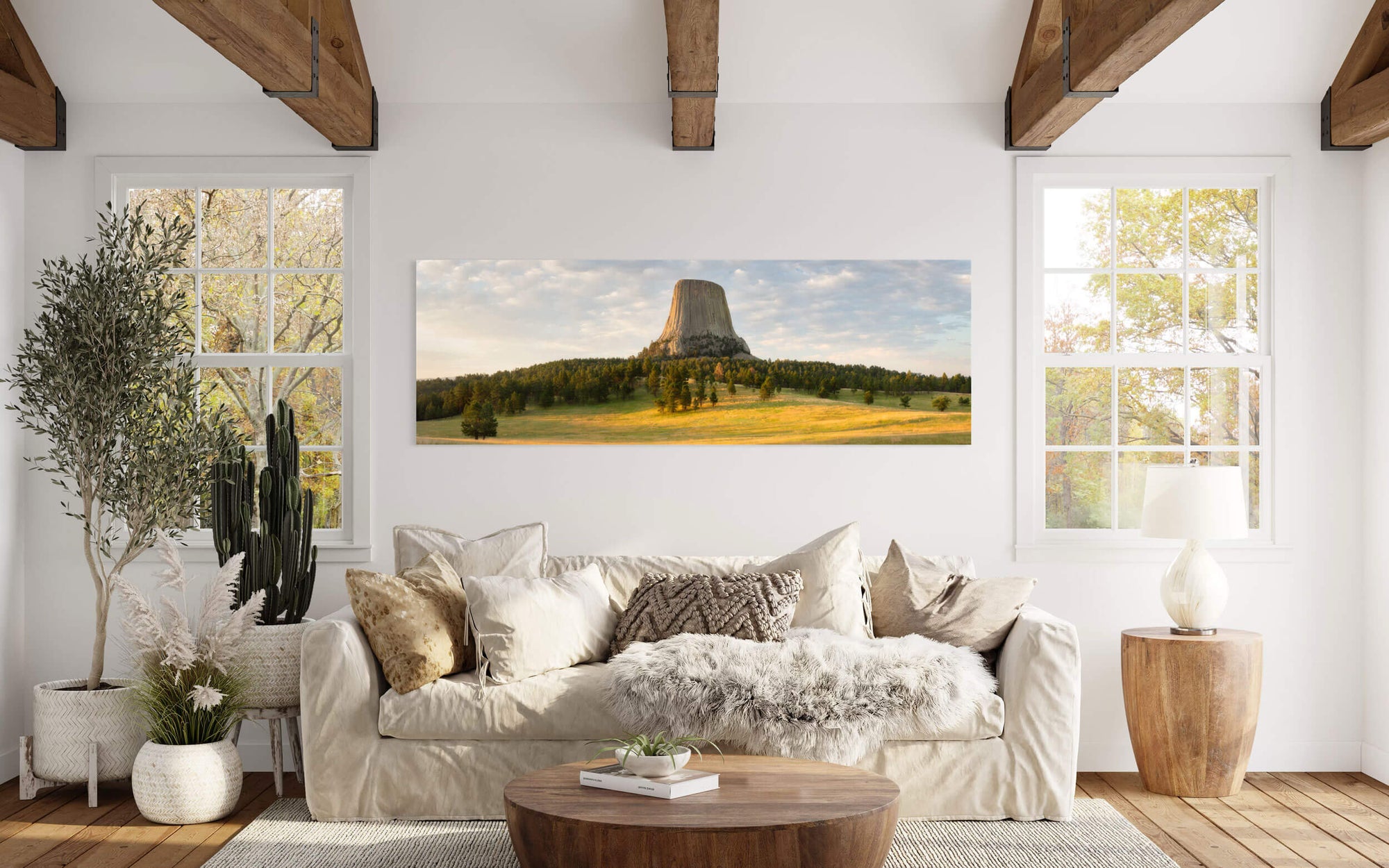 A Devil's Tower National Monument picture at sunrise in Wyoming hangs in a living room.