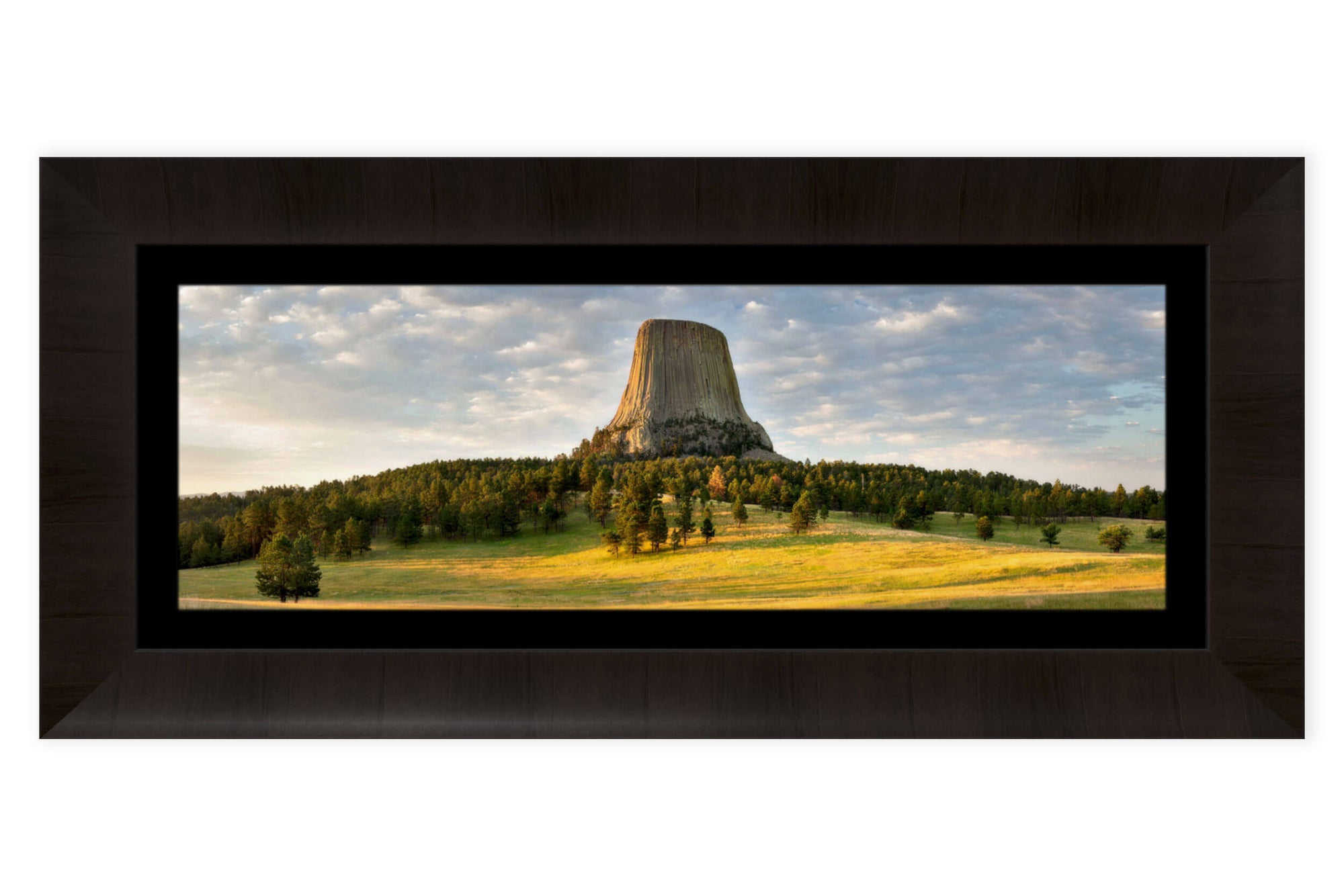 A framed Devil's Tower National Monument picture at sunrise in Wyoming.