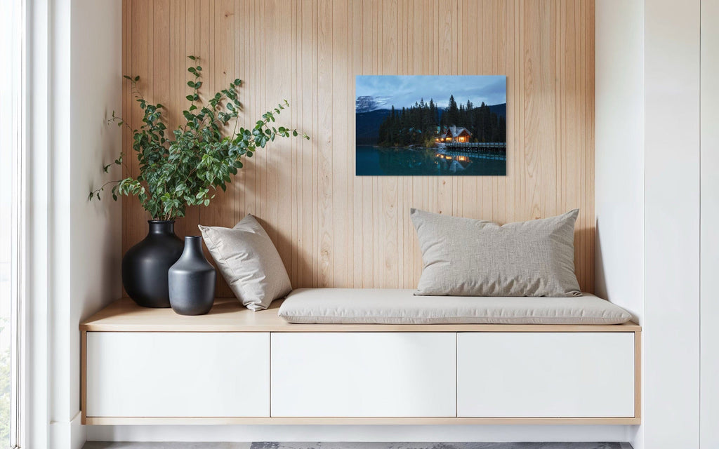 A piece of Banff art showing an Emerald Lake Lodge photo hangs in a sitting area.