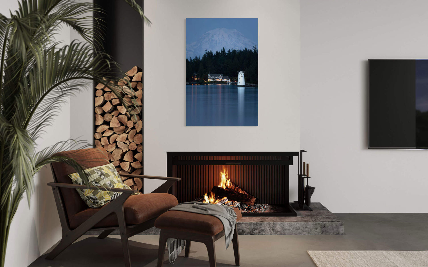 A Fox Island Lighthouse picture with Mount Rainier in the background hangs in a living room.