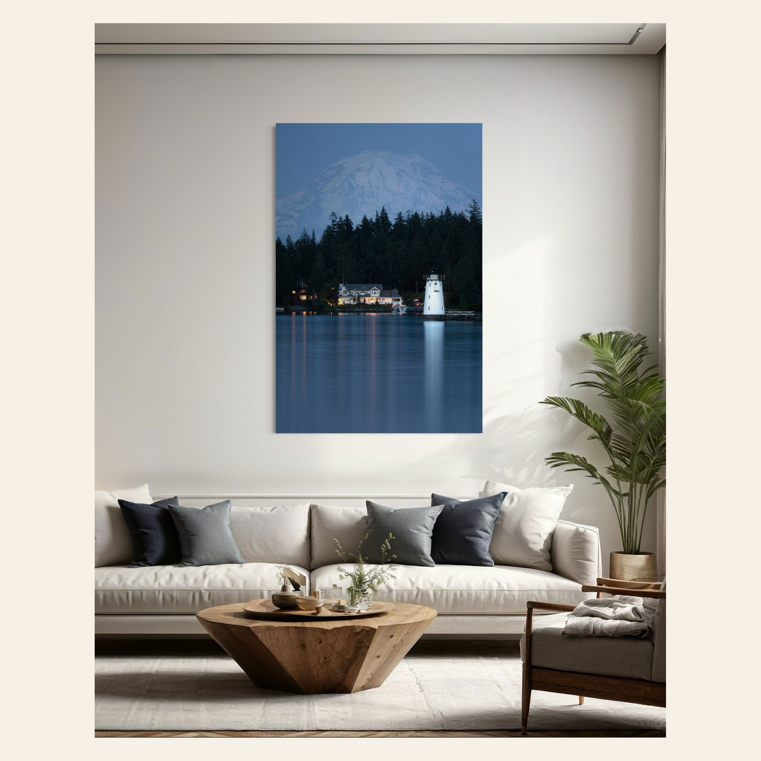 A piece of Seattle art showing the Fox Island Lighthouse with Mount Rainier hangs in a living room.