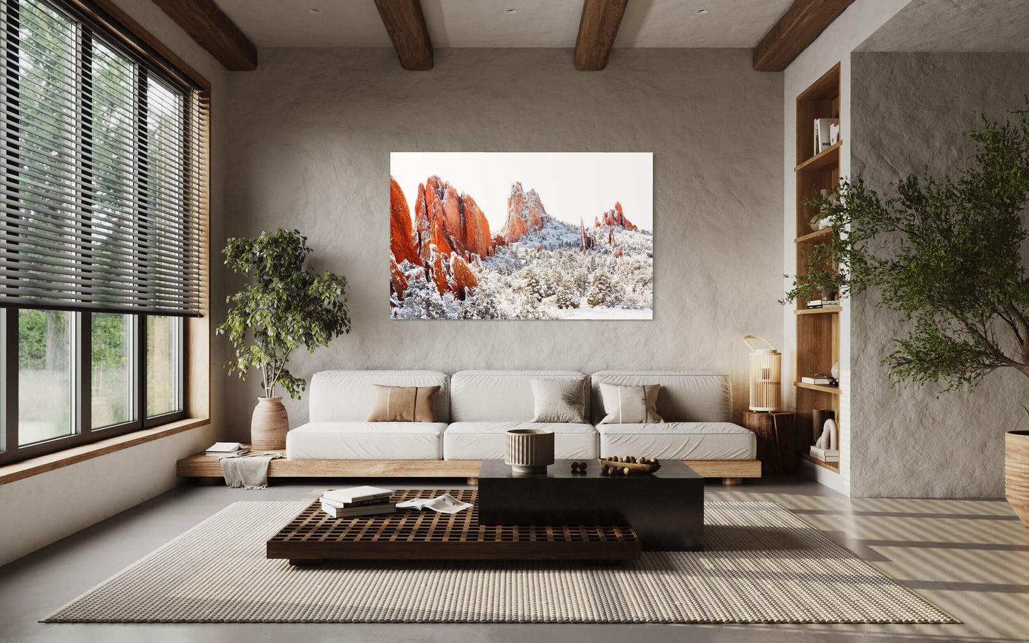 A piece of Colorado Springs art showing the Garden of the Gods in winter hangs in a living room.
