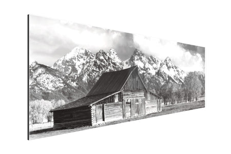 A black and white photograph of the famous barn in Grand Teton National Park.
