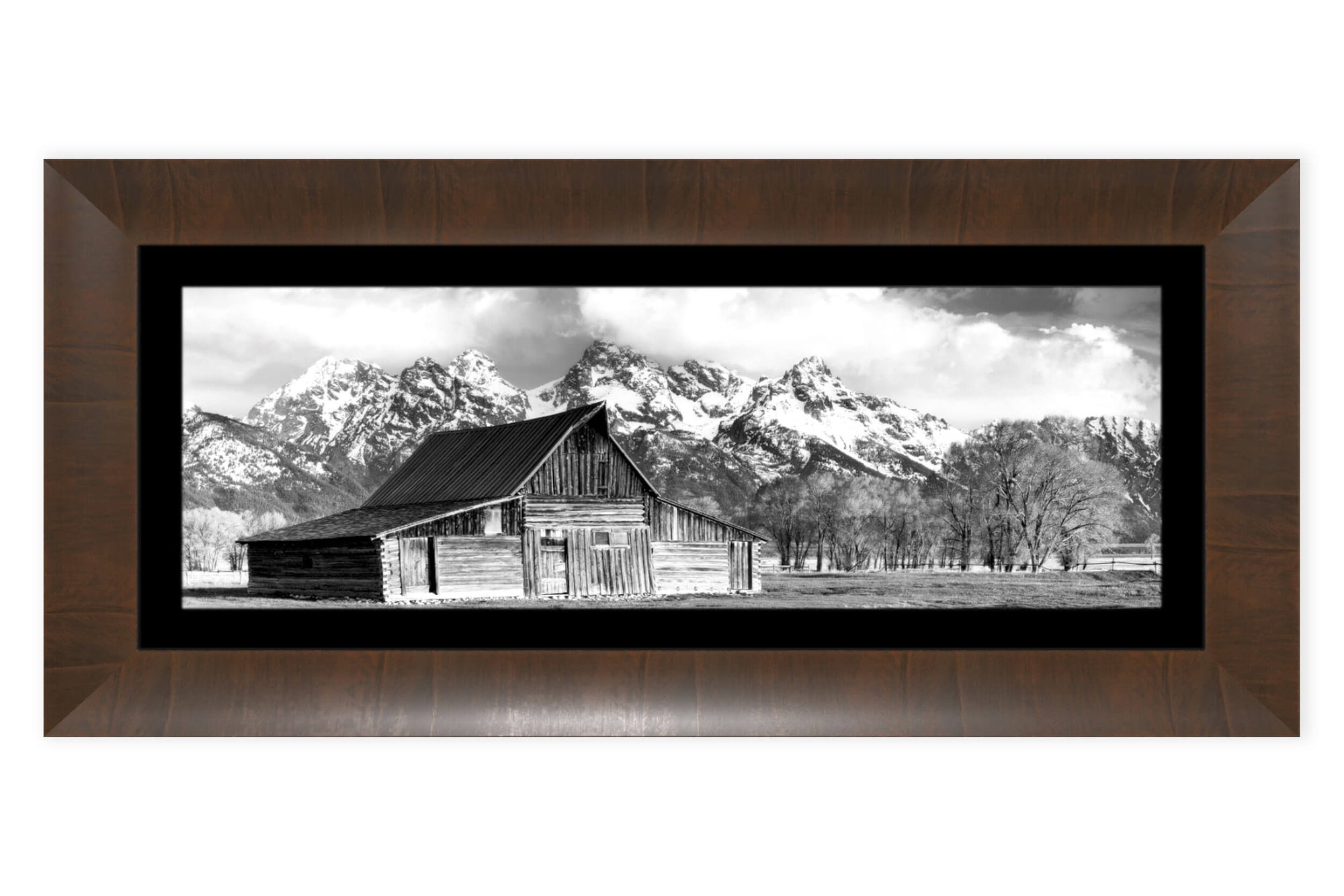 A framed black and white photograph of the famous barn in Grand Teton National Park.