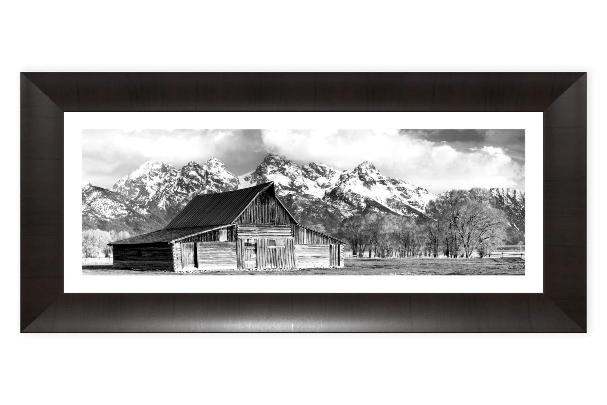 A framed black and white photograph of the famous barn in Grand Teton National Park.