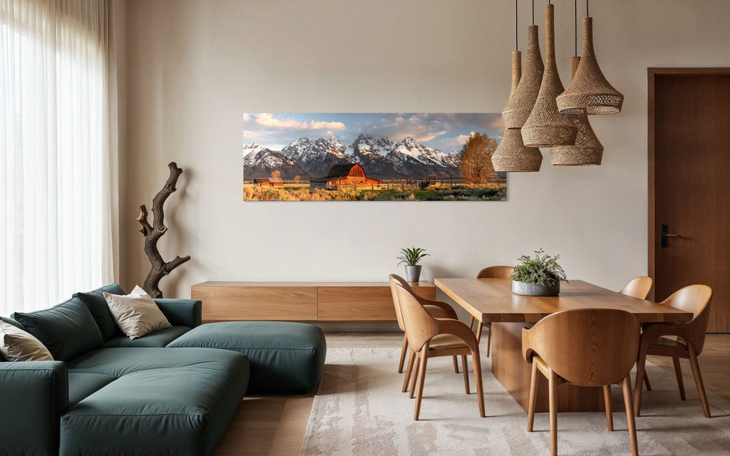 A piece of Jackson Hole art showing a photo of Mormon Row at the foot of the Grand Tetons hangs in a dining room.
