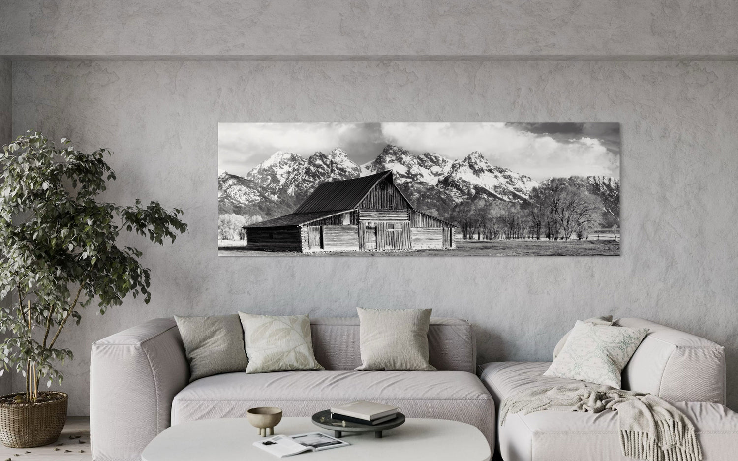 A piece of black and white wall art from Grand Teton National Park hangs in a living room.