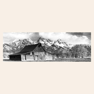 A black and white photograph of the famous Mormon barn in Grand Teton National Park.