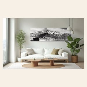 A piece of black and white wall art from Grand Teton National Park hangs in a living room.