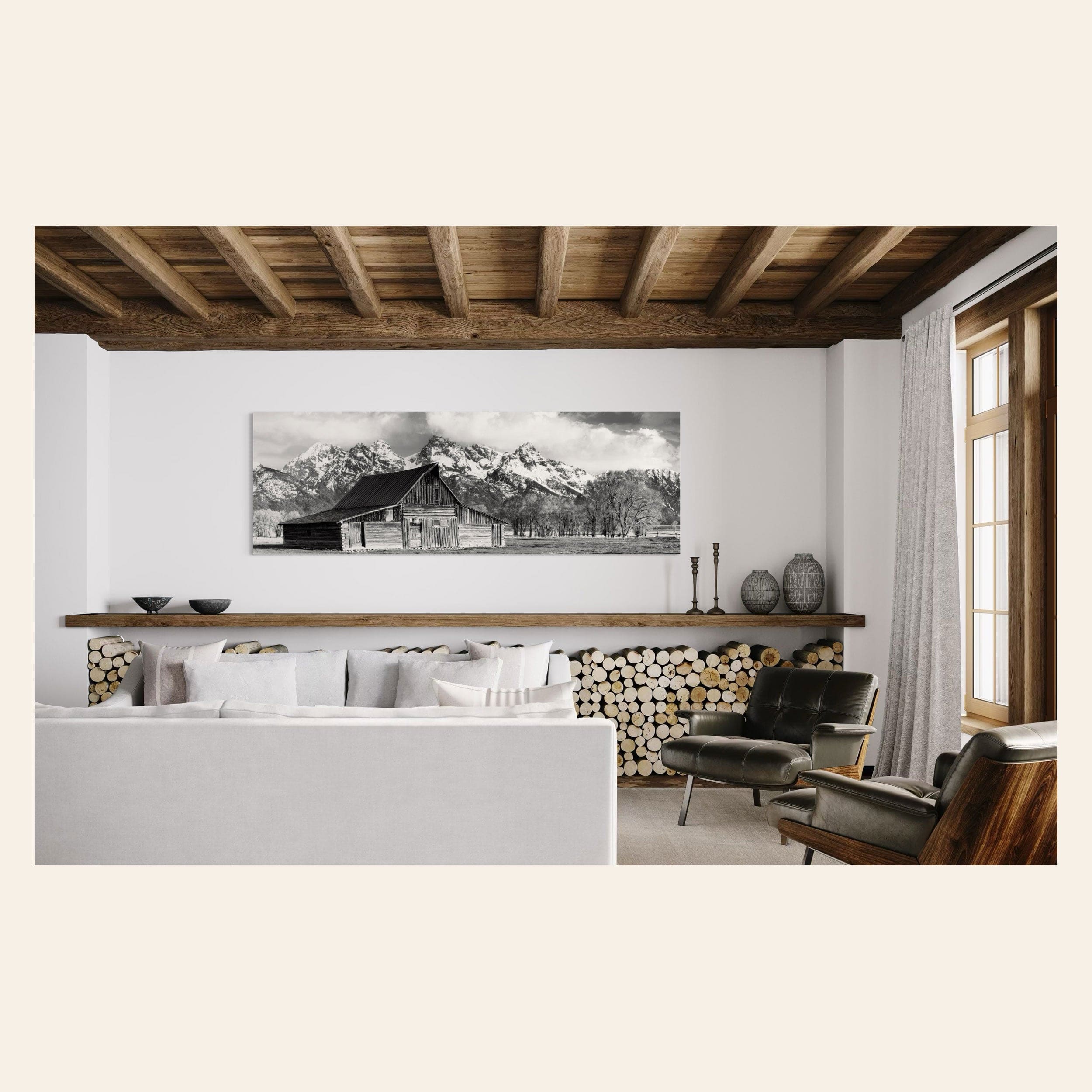 A piece of black and white wall art from Grand Teton National Park hangs in a living room.