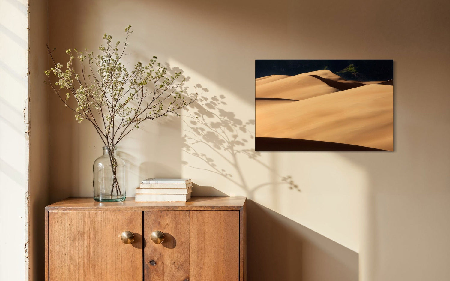 A piece of Colorado art showing a photo of Great Sand Dunes National Park hangs in an entryway.