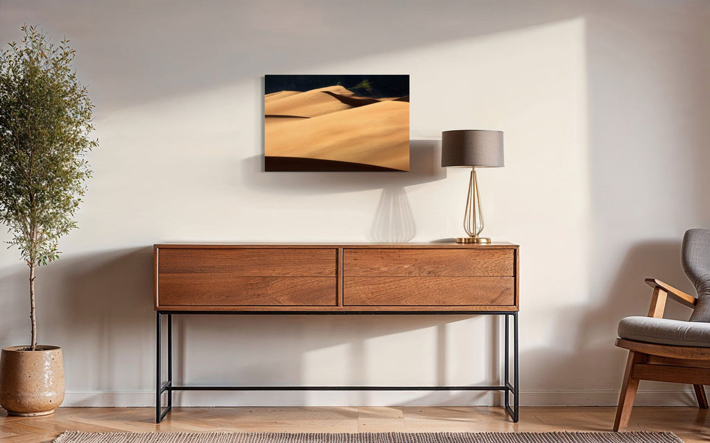 A piece of Colorado art showing a photo of Great Sand Dunes National Park hangs in a sitting area.