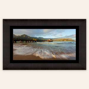 A framed Hanalei Bay sunrise picture from Kauai.