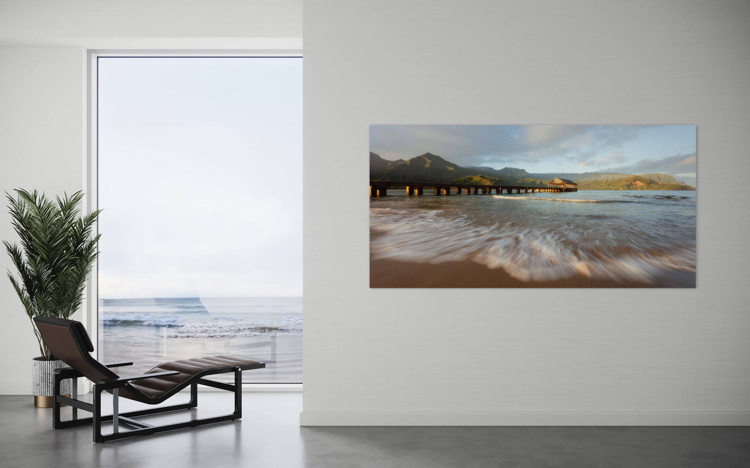 A Hanalei Bay sunrise picture from Kauai hangs in a living room.