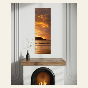 A Hanalei sunset picture from Kauai hangs in a living room.
