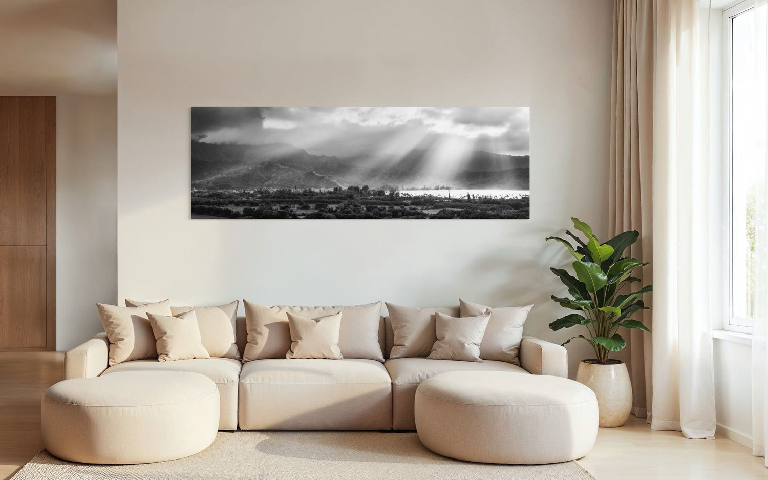 A piece of Hanalei black and white Kauai art hangs in a living room.