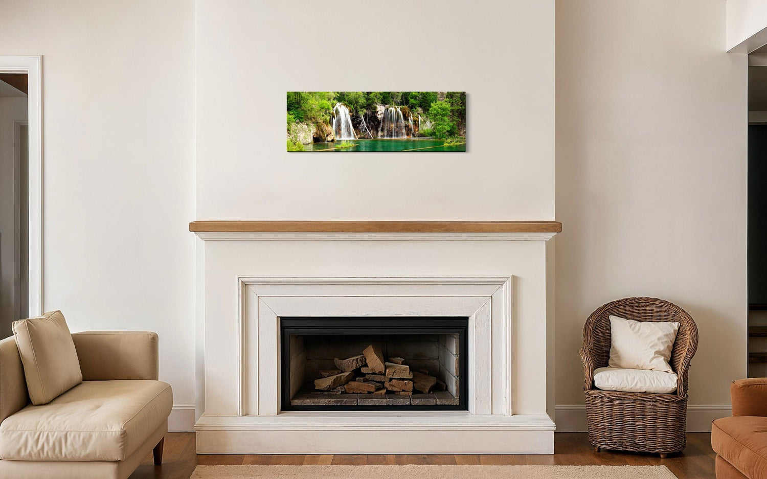 A piece of Colorado art showing a photo of the Hanging Lake waterfall hangs above a fireplace mantel.