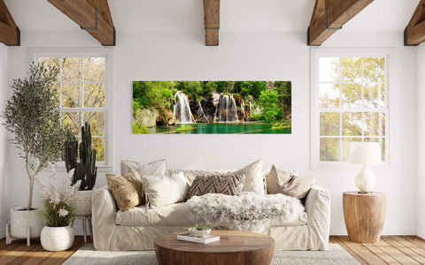 A waterfall picture of Hanging Lake in Colorado hangs in a living room.
